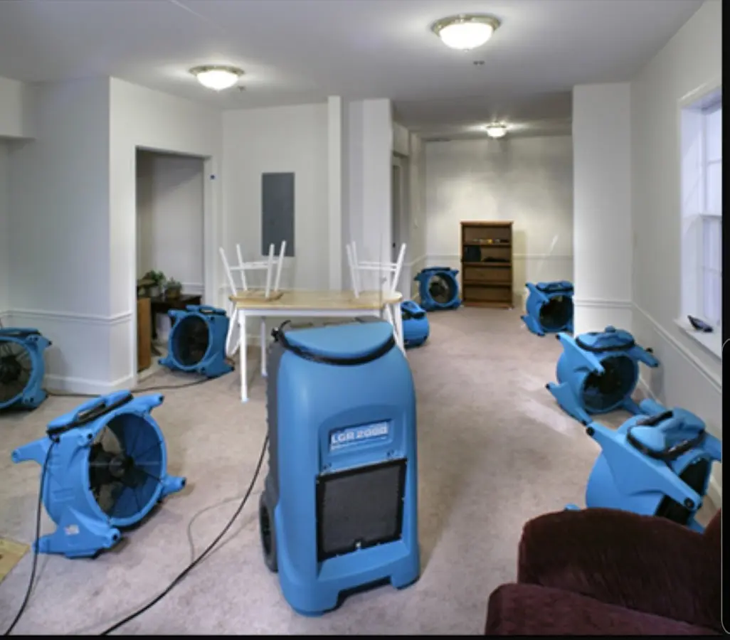 Air movers and dehumidifier setup for Water Damage Restoration in Firestone
